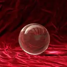 Predictions For 2013 4 clear crystal ball resting on luxurious red fabric, inviting curiosity and mystique.