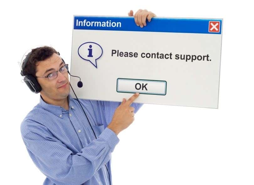 friendly it support representative humorously encourages contacting support with a playful pop-up sign.