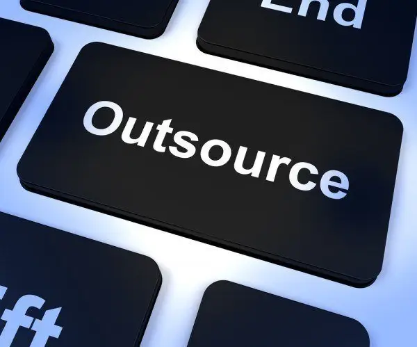 That It Network Specialist Is Going To Cost You 4 close-up of a sleek keyboard highlighting the outsource key, symbolizing digital efficiency.
