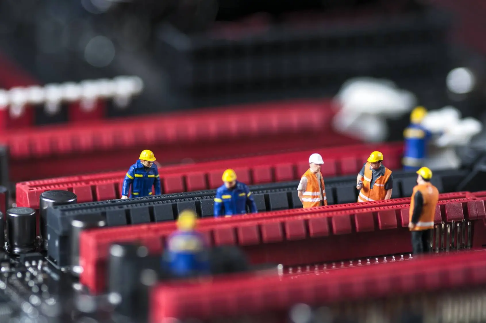 group of engineers fixing computer circuit board. macro photo