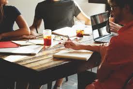 collaborative brainstorming session at a rustic table fostering creativity and teamwork.