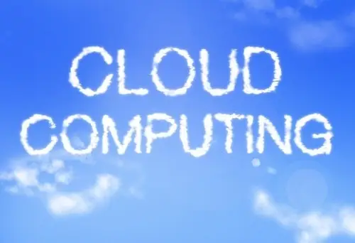 Types Of Cloud Computing 1 fluffy clouds form cloud computing in a peaceful blue sky, merging nature and technology.