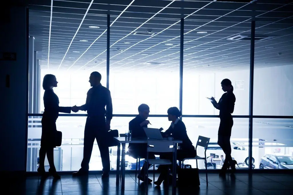Common Tech Issues A Managed Service Provider Can Resolve 2 modern office scene showcasing collaboration, partnership, and individual focus among professionals.