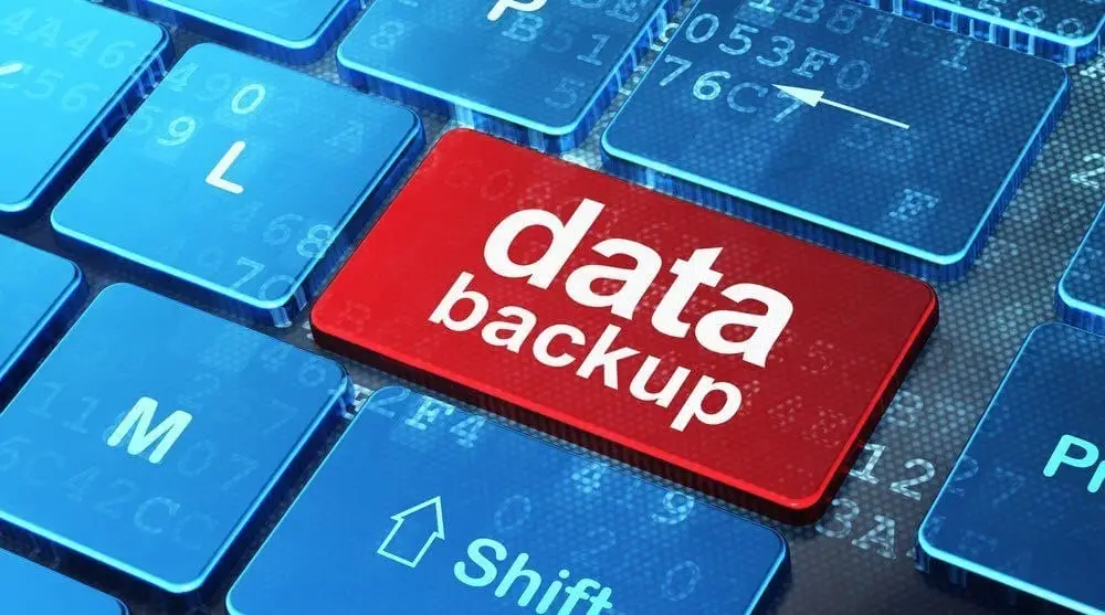 Are Your Backup And Recovery Methods Effective? 6 essential data backup key on a modern keyboard emphasizing digital safety and data protection.