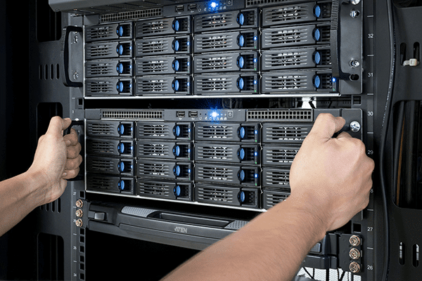 technician performing server maintenance in a modern data center for optimal network performance.