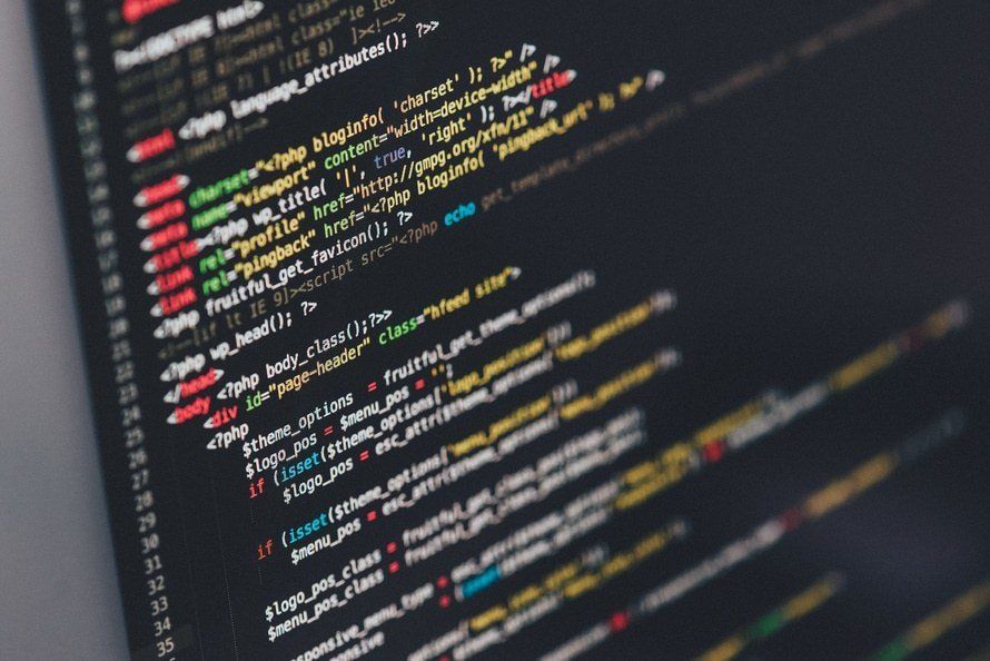 colorful code on a dark screen symbolizes it support for securing data backups against ransomware.