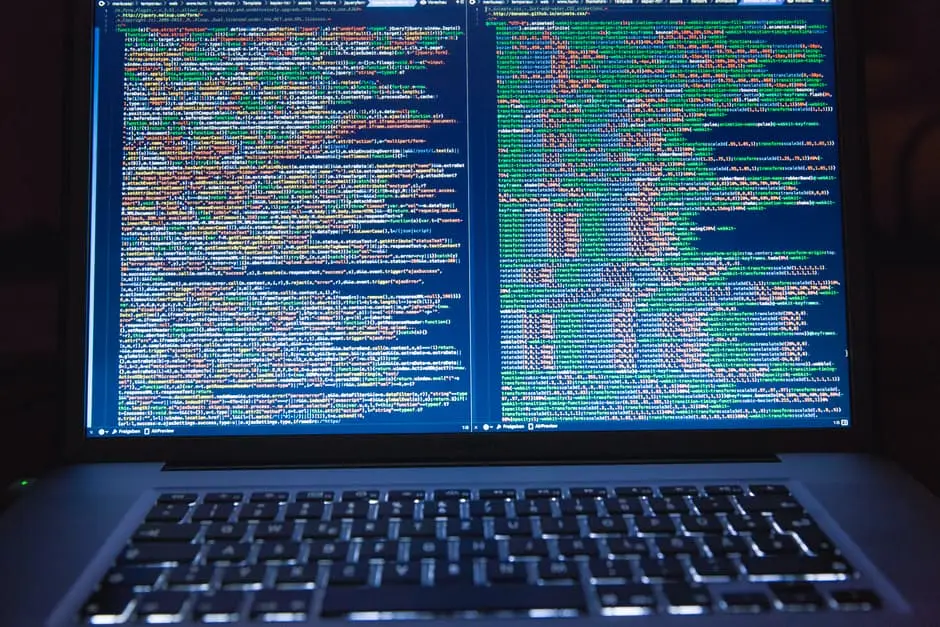 Do You Know How Avoid Being Hit By Ransomware? Learn Now! 1 close-up of a laptop displaying vibrant code, highlighting a programmers focused workspace.