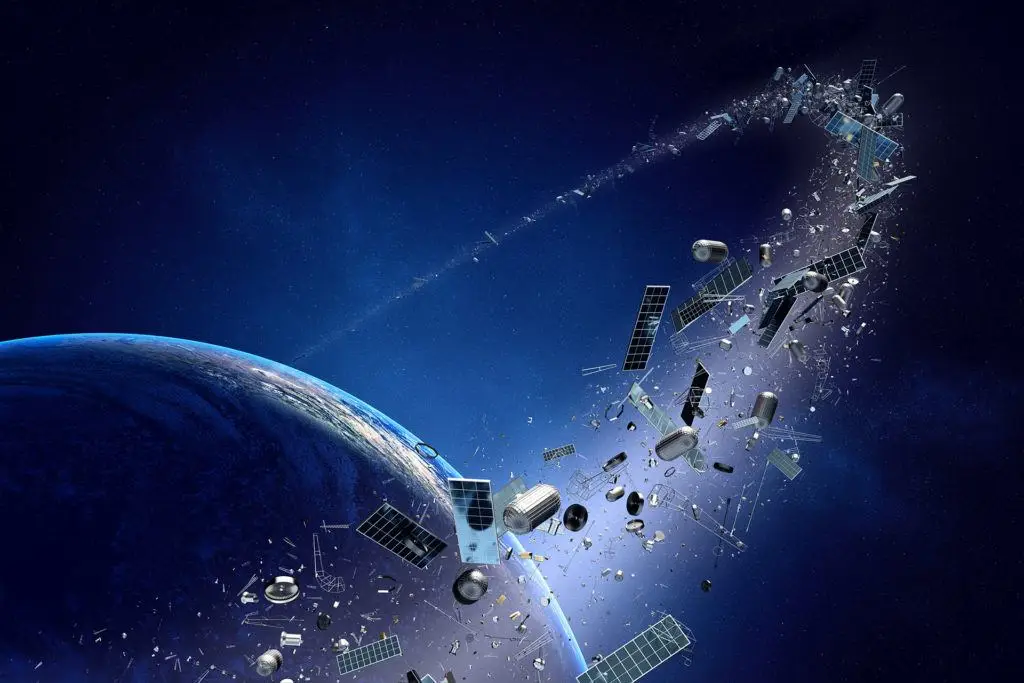 What To Do With Your Old Power Converters, According To Star Wars 5 space debris orbits earth, highlighting risks to satellites amid a stunning celestial backdrop.