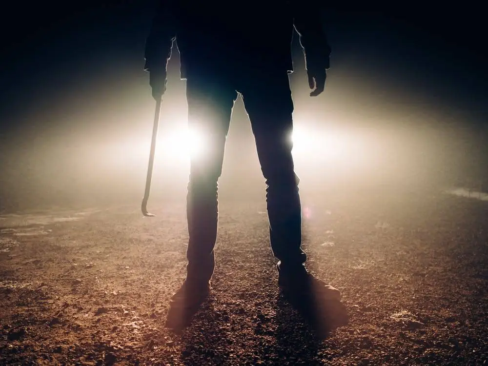 Backup Data Offsite To Thwart Cyber Criminals 6 mysterious figure looms in fog, exuding tension with a cane in an eerie setting.