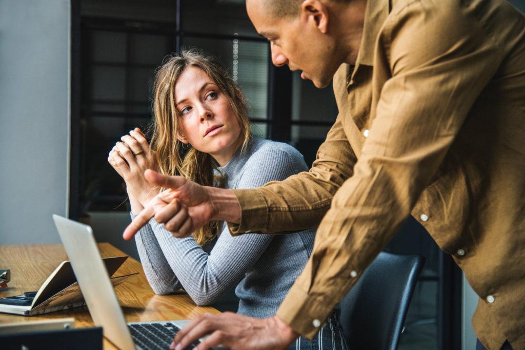 engaged professionals discussing cybersecurity strategies in a modern office environment.