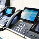 rows of VOIP office phones