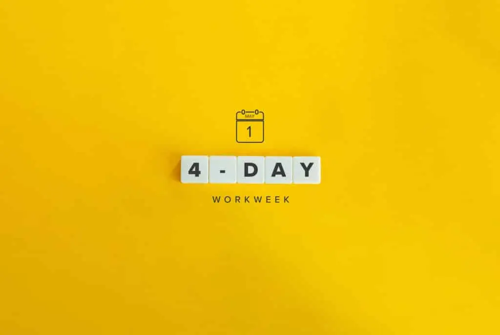 Should Your Business Consider The Four-Day Workweek? 2 4-day workweek banner in bold letters on a vibrant orange background.