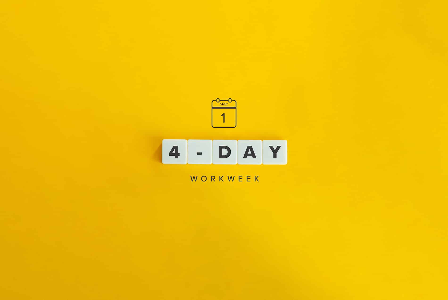 banner and concept. Block letters on bright orange background reading "4 day workweek"