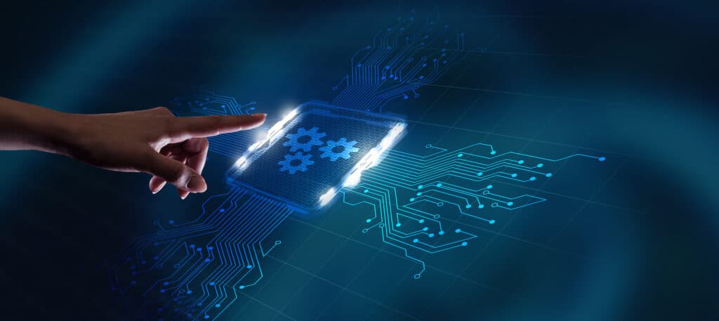 hand interacting with a glowing interface symbolizing automation and technology in modern business.