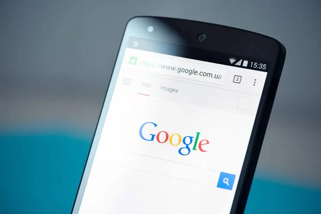 Tip: Switching Your Default Android Browser 2 sleek smartphone displaying google homepage with vibrant background and user-friendly search interface.