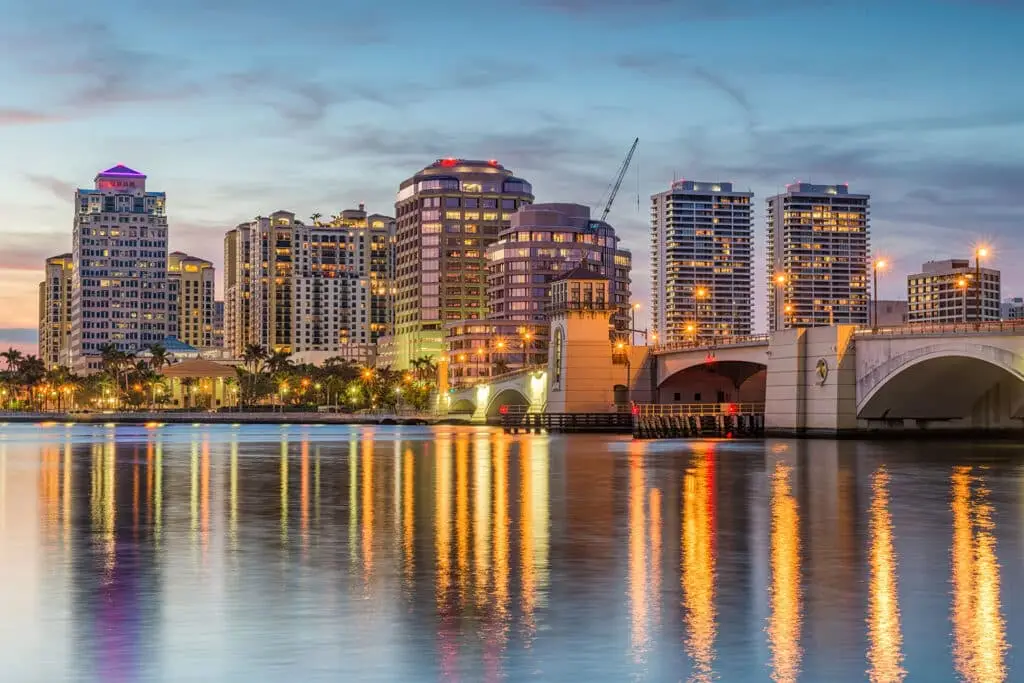 Business Network Support In Fort Lauderdale 6 dusk skyline of west palm beach, reflecting vibrant colors in tranquil intracoastal waters.