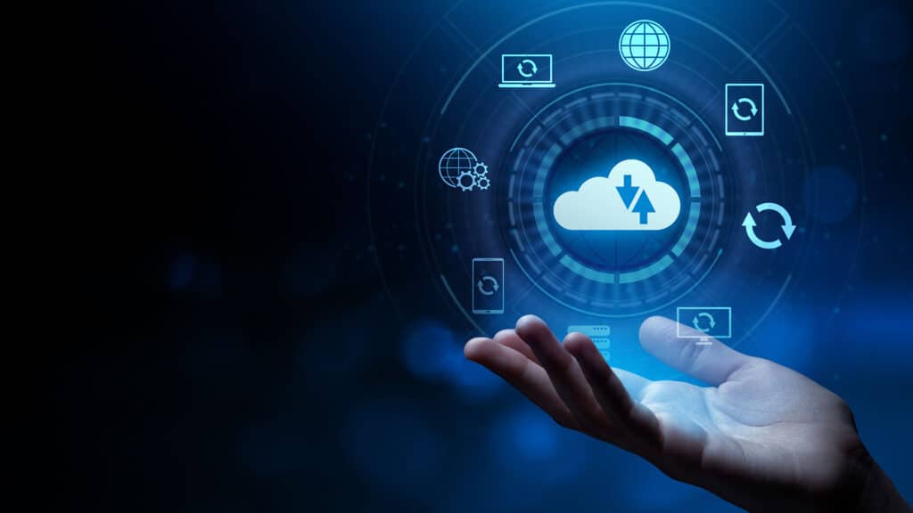 futuristic hand reaching for a glowing cloud icon, symbolizing interconnected cloud computing and data transfer.
